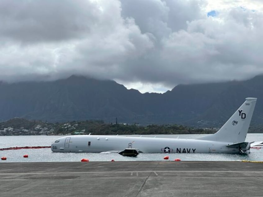 us navy removes fuel from plane that overshot hawaii runway and is now resting on a reef and sand