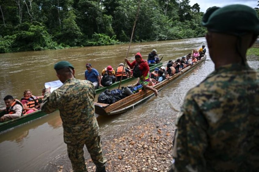 Migrants arrive at a reception center in Panama after crossing the Darien jungle from Colo