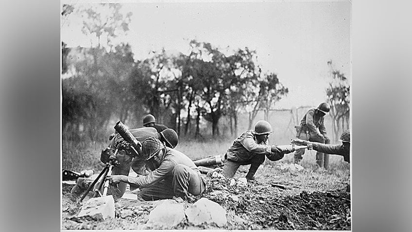 Members of the 92nd Infantry are seen in battle in this photograph from the Defense POW/MIA Accounting Agency.