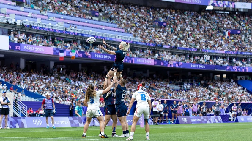 sammy sullivan lifted by teammates during rugby sevens game