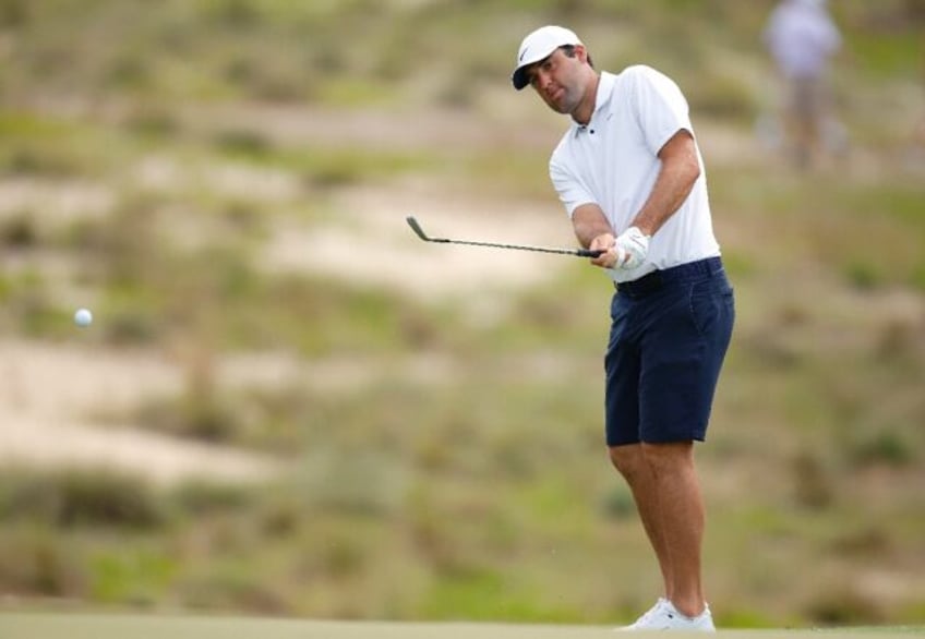 World number one Scottie Scheffler chips onto the fifth green at Pinehurst during a practi