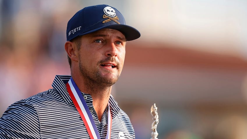 Bryson DeChambeau holds US Open trophy