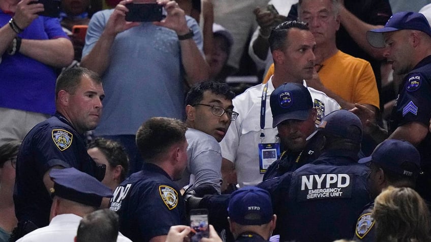 us open protester who glued his feet to floor says nypd took him to psych ward after his arrest