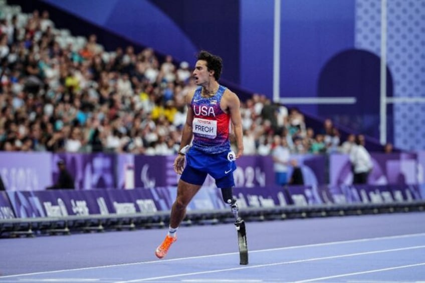 Ezra Frech celebrates after winning the gold medal in the men's T63 100m at the Paralympi