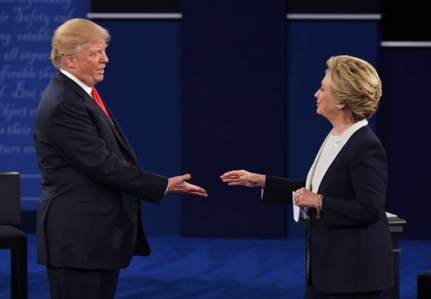 Democratic candidate Hillary Clinton and Republican candidate Donald Trump shake hands aft