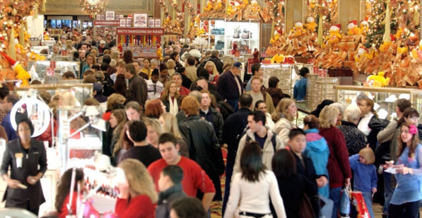 NEW YORK - NOVEMBER 28: Shoppers clog the aisles at Macy's Department store November 28, 2003 in New York City. Black Friday , the day after Thanksgiving and traditionally the kickoff to the Christmas shopping season is expected to be big, thanks to a rebounding U.S. economy that is positioned …