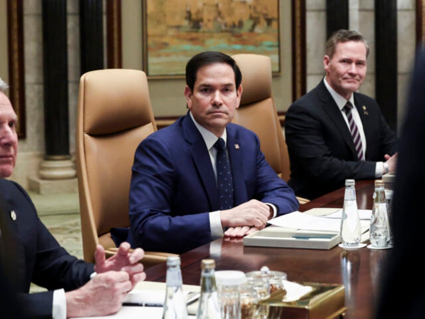 U.S. Secretary of State Marco Rubio, center, sits next to U.S. National Security Advisor M