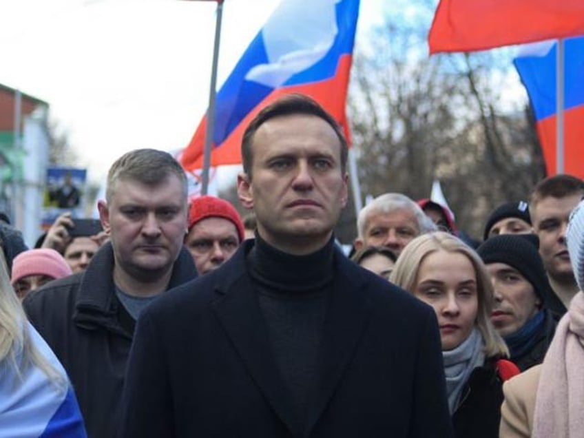 Russian opposition leader Alexei Navalny, his wife Yulia, opposition politician Lyubov Sobol and other demonstrators march in memory of murdered Kremlin critic Boris Nemtsov in downtown Moscow on February 29, 2020. (Photo by Kirill KUDRYAVTSEV / AFP) (Photo by KIRILL KUDRYAVTSEV/AFP via Getty Images)