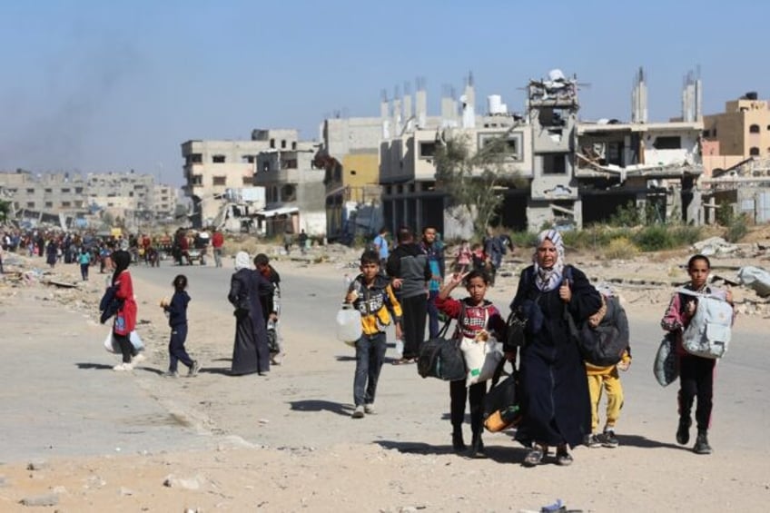 Displaced Palestinians fleeing Israeli military operations in Beit Lahia in the northern G