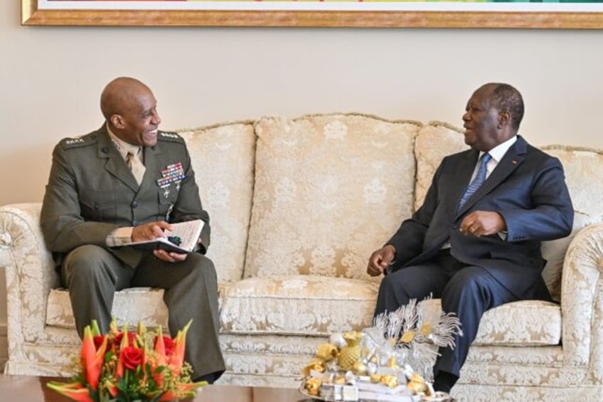 Ivorian President Alassane Ouattara (R) meets General Michael Langley, commander of US Afr