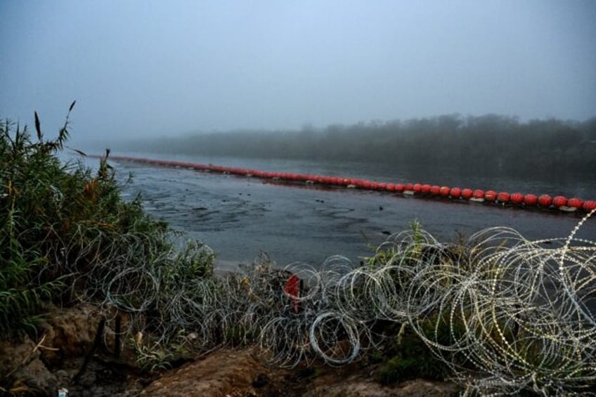 A floating barrier in the middle of the Rio Grande, which forms the US-Mexico border at Eagle Pass, Texas, is aimed at reducing the crossings of undocumented migrants into the United States