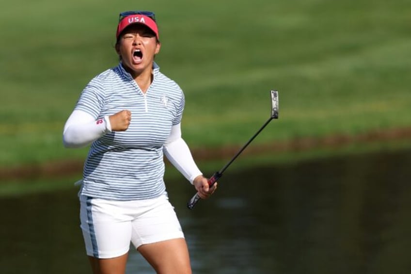 Megan Khang of the United States reacts to making her eagle putt on the 14th hole on the w