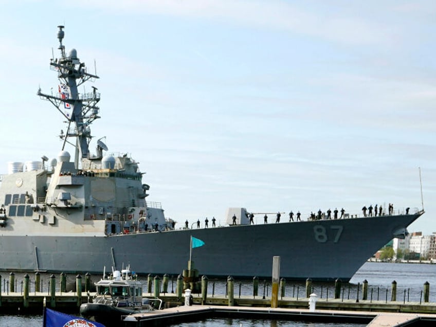 File - The USS Mason, an Arleigh Burke-class destroyer, passes a dock in Norfolk, Va., April 8, 2021. Officials said the USS Mason shot down a suspected Houthi drone flying in its direction during an incident in which two missiles fired from territory held by Yemen's Houthi rebels missed a …