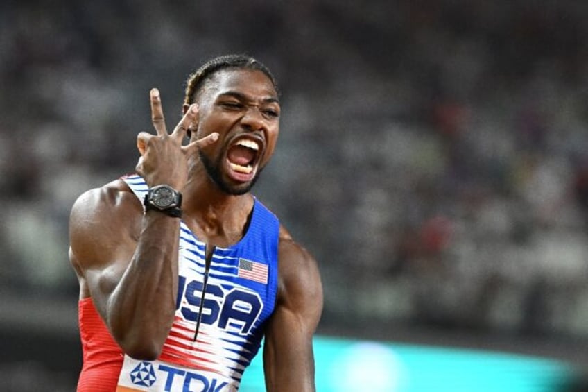 Noah Lyles celebrates his third gold medal at the outdoor World Championships in Budapest