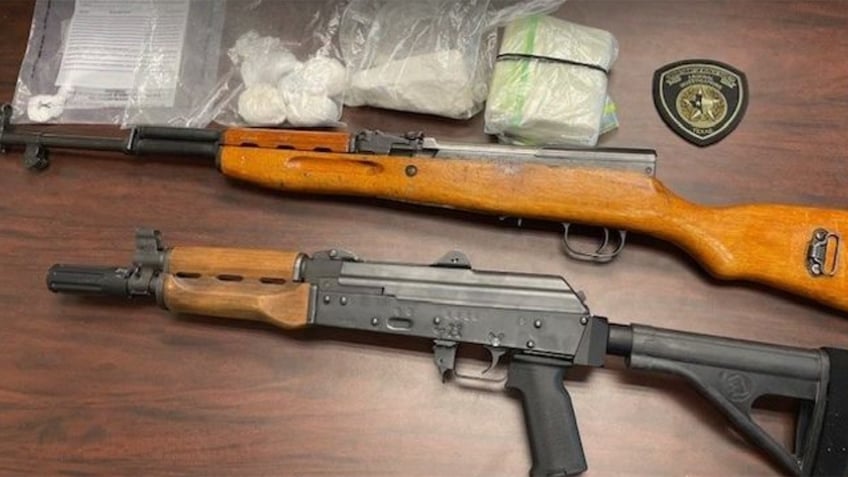 Pictured are two long guns and cocaine seized at the apartment in El Paso's Lower Valley on Friday.