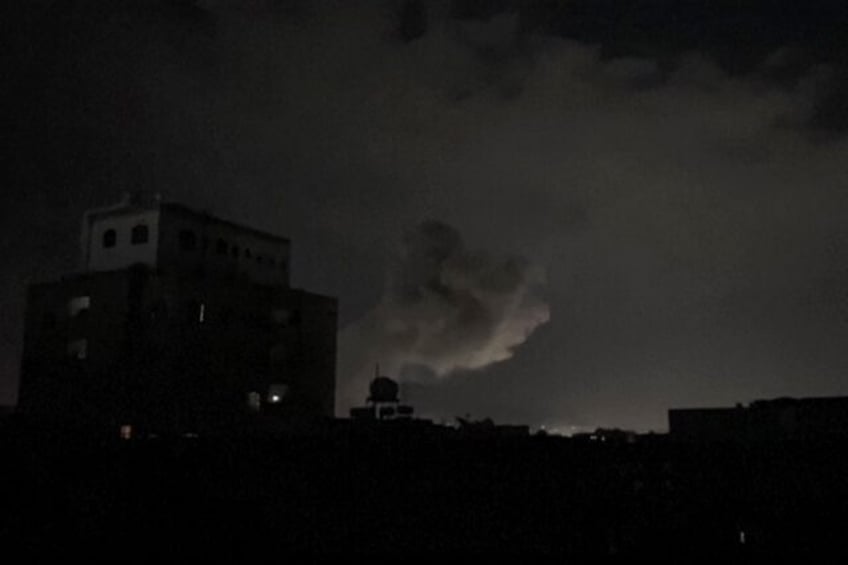 This image from AFPTV footage shows smoke rising following bombardment on Yemen's Huthi-co