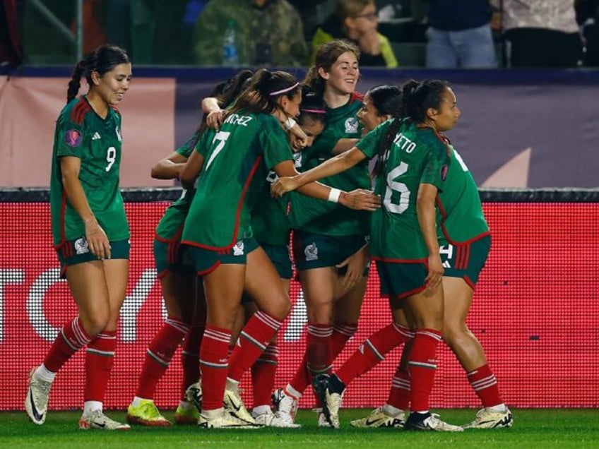 Mexico's players celebrate after Lizbeth Ovalle's opening goal in a 2-0 victory over the U