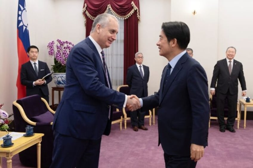 This is handout photo by the Taiwan Presidential Office taken and released on January 25, 2024 shows US Representative Mario Diaz-Balart (L) shaking hands with Taiwan's President-elect Lai Ching-te during a meeting at the Presidential Office. Two US lawmakers met with Taiwanese president-elect Lai Ching-te on January 25 to reaffirm …