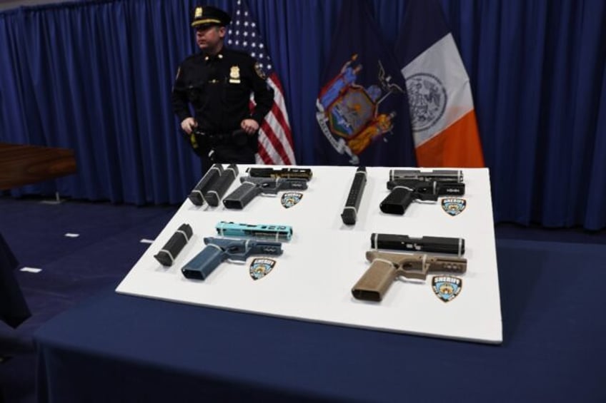 Confiscated 'ghost guns' being displayed at a news conference in New York by city officia