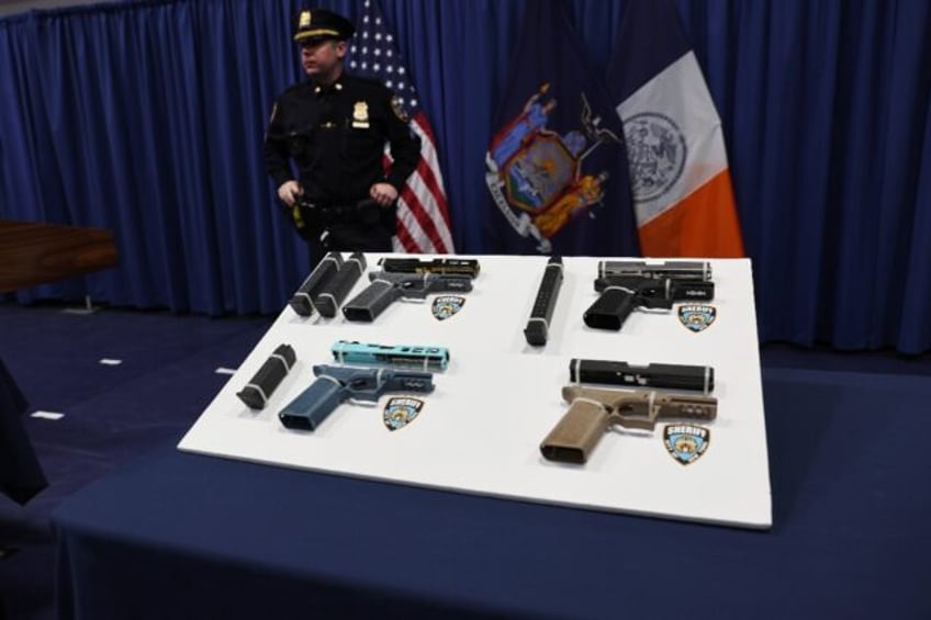 Confiscated 'ghost guns' being displayed at a news conference in New York by city officia