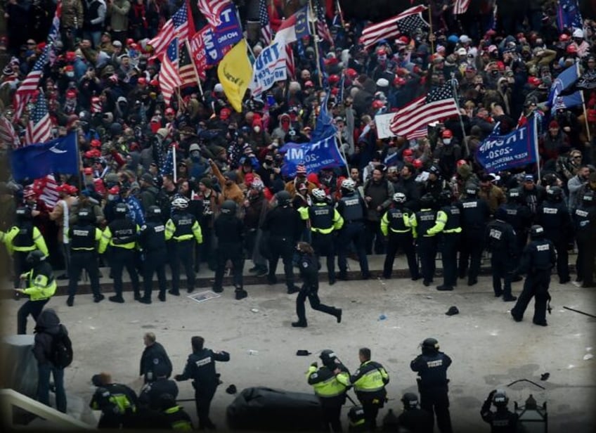 Police hold back supporters of US president Donald Trump outside the US Capitol on January