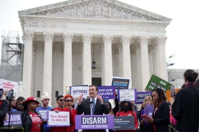 US Senator Chris Murphy speaks outside the Supreme Court as the justices weigh whether per