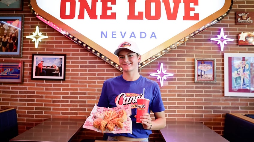 Katie Grimes holds up Raising Cane's food