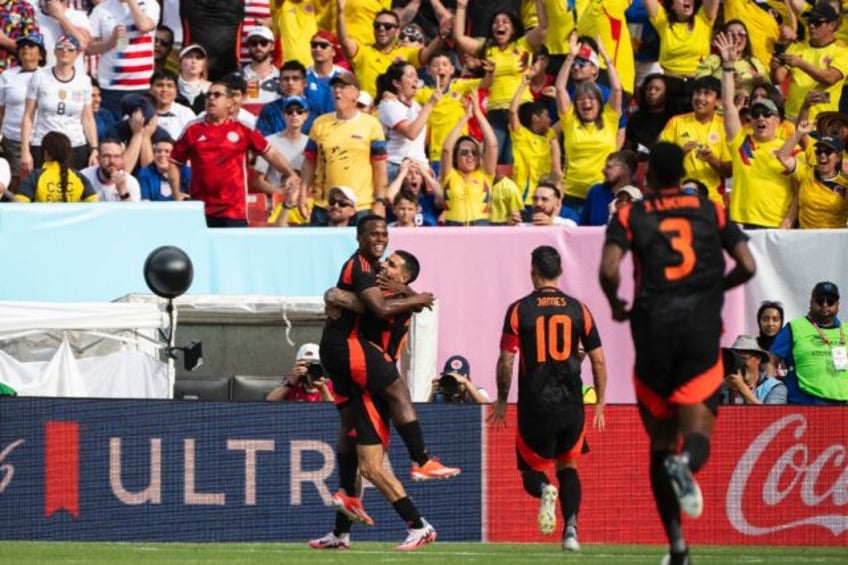 Colombia's Jhon Arias celebrates after firing his team into the lead during a 5-1 drubbing