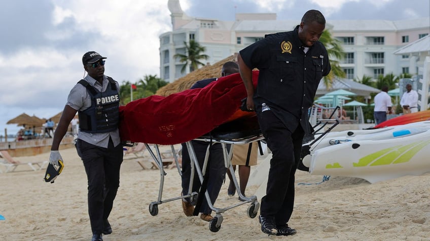 us tourist paddleboarding in bahamas killed by shark police