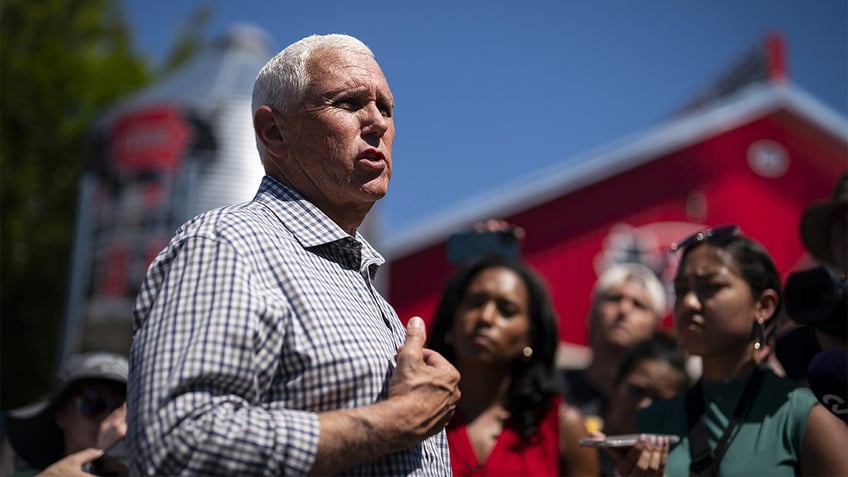 Mike Pence speaking outside with barn in background