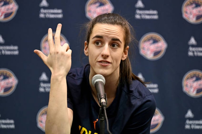 Caitlin Clark of the Indiana Fever talks to the media before the game against the Washington Mystics at Capital One Arena on June 07, 2024 in...