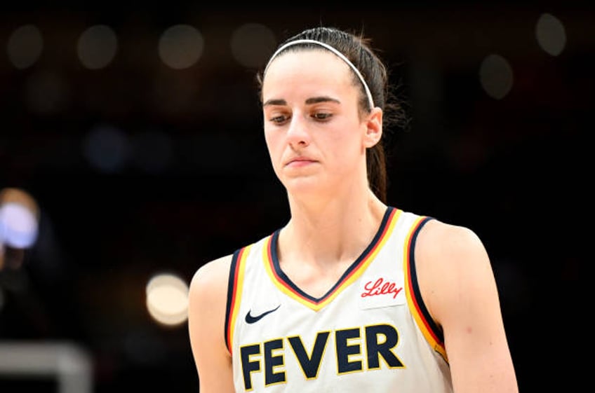 Caitlin Clark of the Indiana Fever walks down the court during the game against the Washington Mystics at Capital One Arena on June 07, 2024 in...