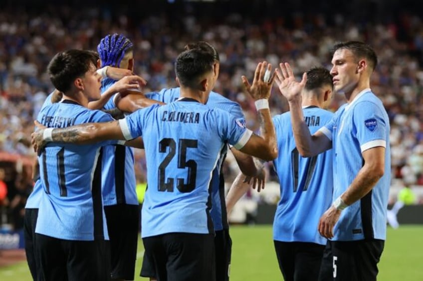 Uruguay's Mathias Olivera celebrates after scoring the goal which helped eliminate the Uni