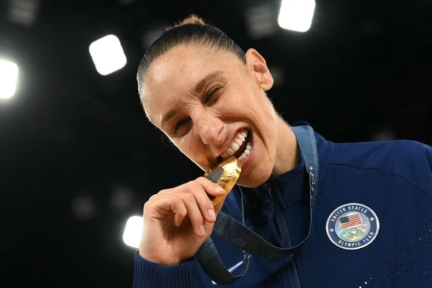 American Diana Taurasi poses with her sixth Olympic gold medal after the United States bea