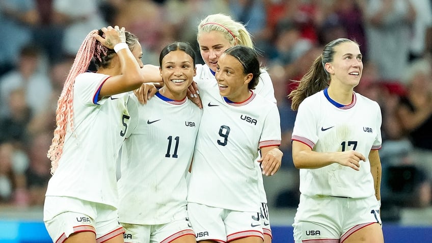 USWNT hugs after goal