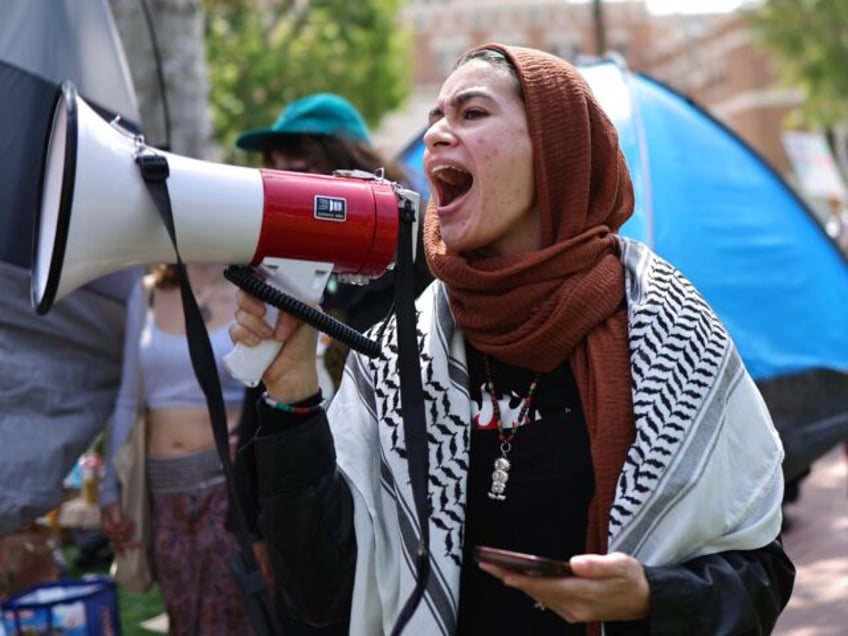 LOS ANGELES, CALIFORNIA - APRIL 24: Pro-Palestine demonstrators march at an encampment in