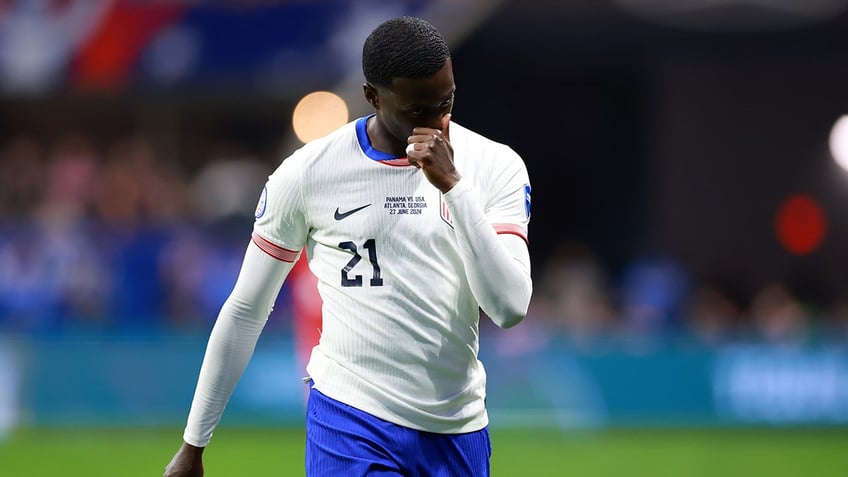 Timothy Weah walks off field