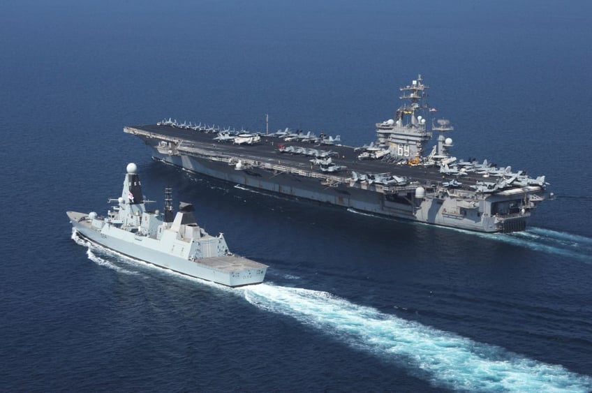 usn and royal navy on defence as houthis launch largest attack on red sea shipping yet