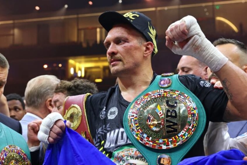 Ukraine's Oleksandr Usyk celebrates his victory over Britain's Tyson Fury for the undisput