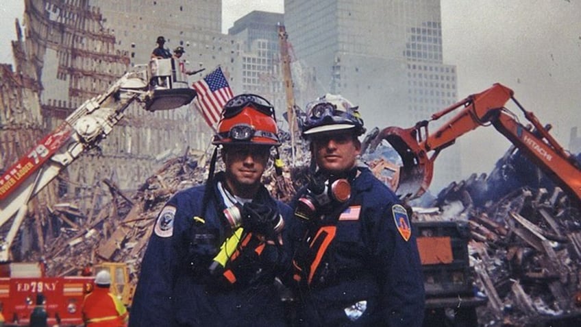 SLC Fire Captain Michael Harp at Ground Zero with another firefighter