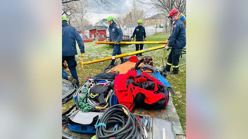 rescuers working to stabilize trench