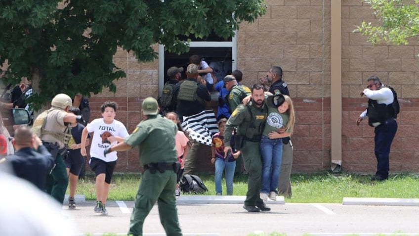 Children run to safety during a mass shooting