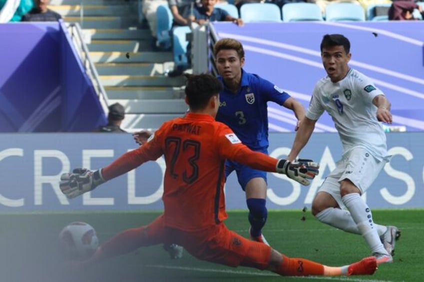 Uzbekistan's Azizbek Turgunboev tucks the ball away