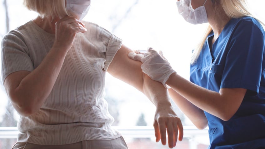 Woman getting vaccine