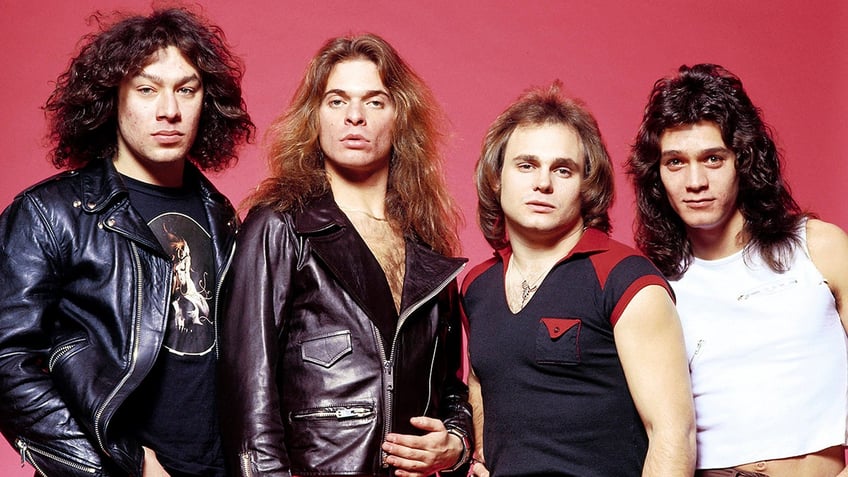 Alex Van Halen, David Lee Roth, Michael Anthony, and Eddie Van Halen pose together for a Van Halen band portrait