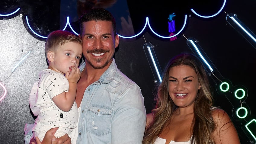 A photo of Jax Taylor and Brittany Cartwright with their son