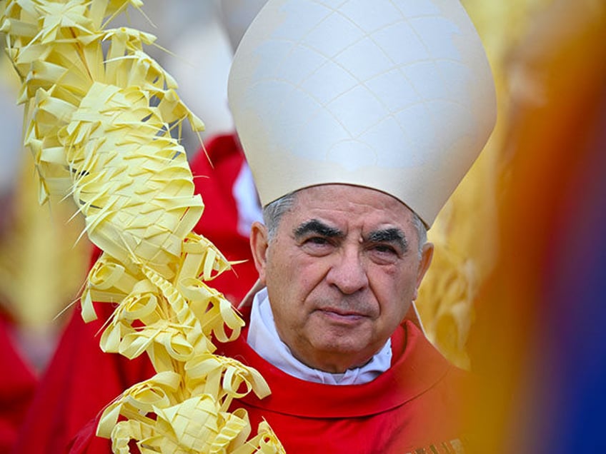 Italian Cardinal Giovanni Angelo Becciu takes par in the procession of the Palm Sunday mass on April 2, 2023 at St. Peter's square in The Vatican. (Photo by Filippo MONTEFORTE / AFP) (Photo by FILIPPO MONTEFORTE/AFP via Getty Images)