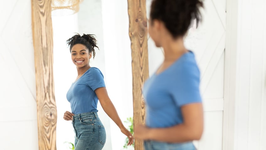 Woman smiling in mirror