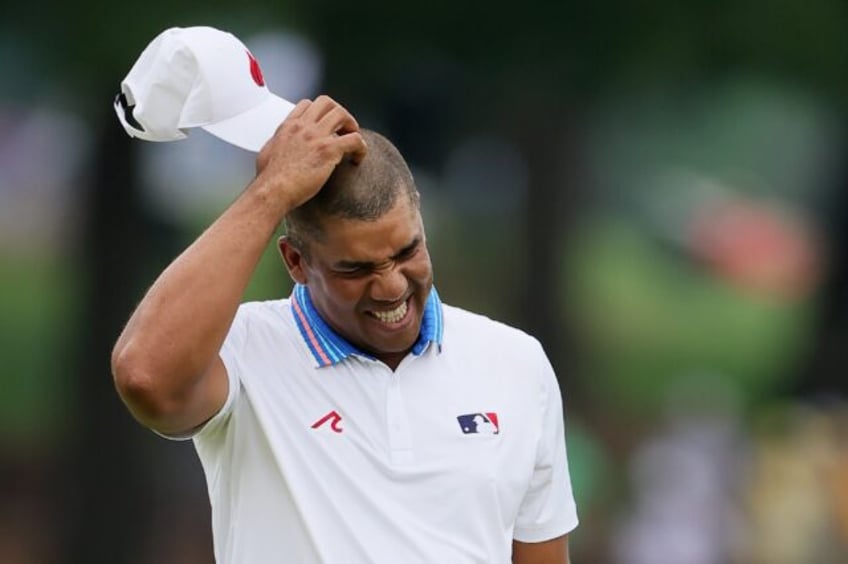 Jhonattan Vegas of Venezuela made a double bogey on the 18th hole but still lead when he r