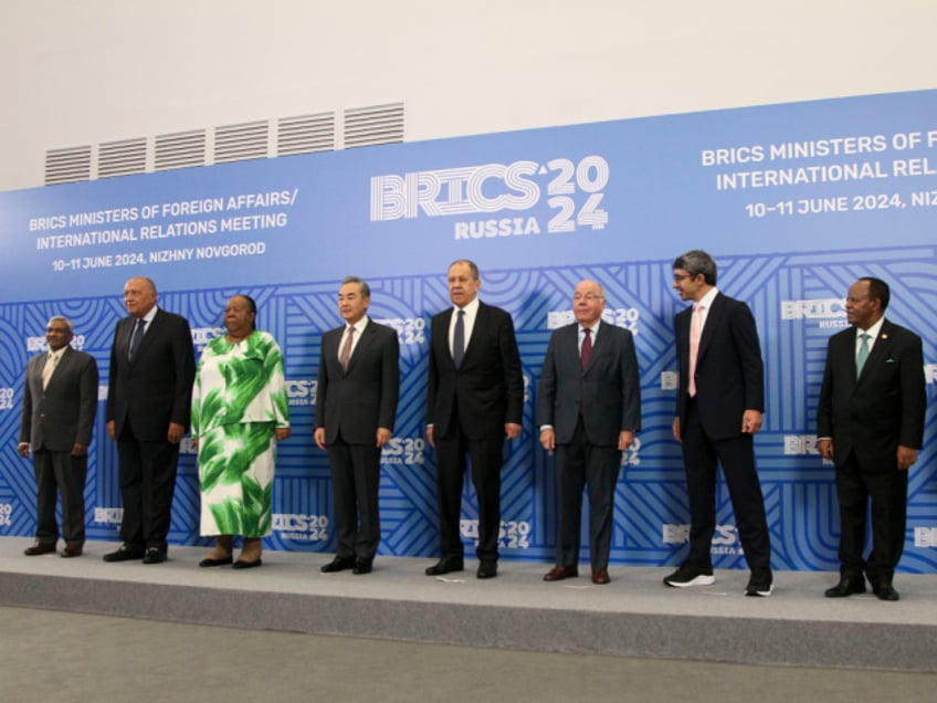 From left, India's BRICS Sherpa Dammu Ravi, Egypt's Foreign Ministers Sameh Shoukry, South Africa's Foreign Ministers Naledi Pandor, China's Foreign Minister Wang Yi, Russian Foreign Minister Sergey Lavrov, Brazil's Foregn Minister Mauro Vieira, UAE Foreign Minister Sheikh Abdullah bin Zayed Al Nahyan, Ethiopia's Foreign Minister Taye Atske Selassie and Iranian Acting Foreign Minister Ali Bagheri Kani pose for a photo on the sidelines of the meeting of BRICS foreign ministers in Nizhny Novgorod, Russia, Monday, June 10, 2024. (AP Photo/Roman Yarovitsin)